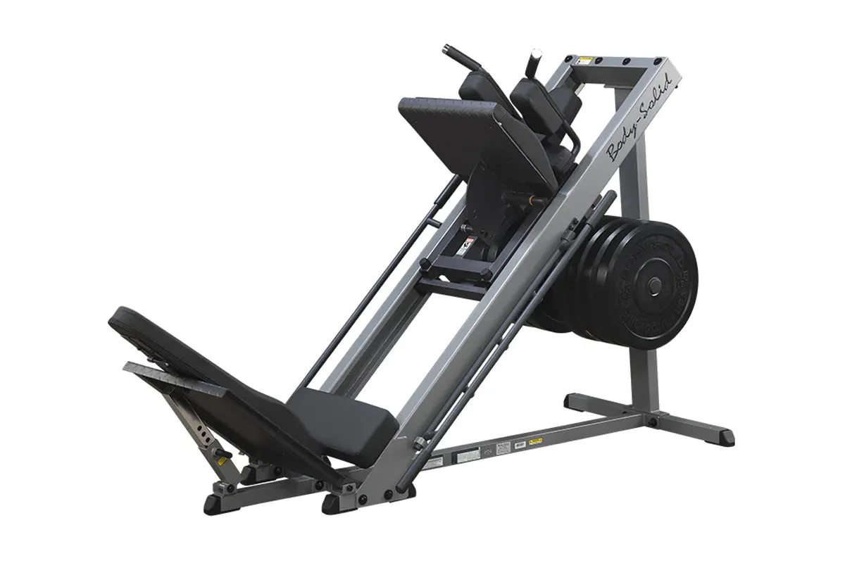 Body-Solid Leg Press / Hack Squat (GLPH1100B), Olympic weight plates, Rogue Fitness squat rack, Reflective running vest